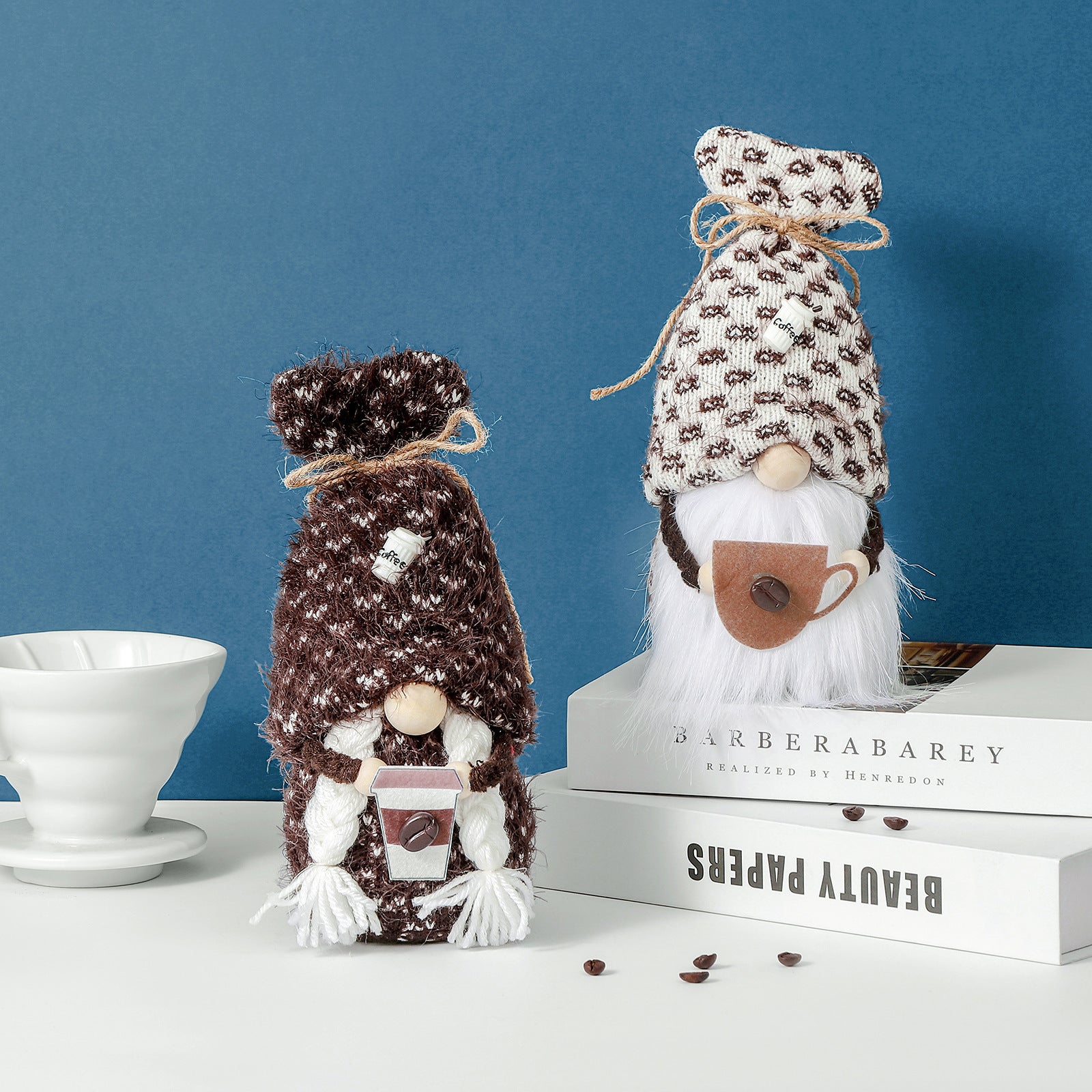 Knitted coffee gnomes holding cup of coffee