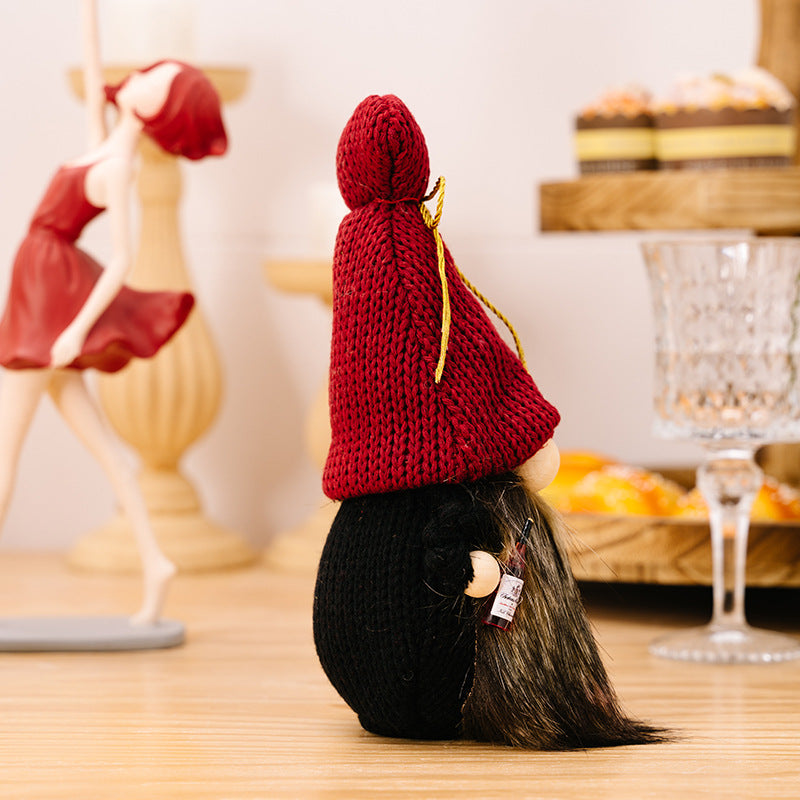 Wine red knit hat gnome holding champagne for dinning table or bar