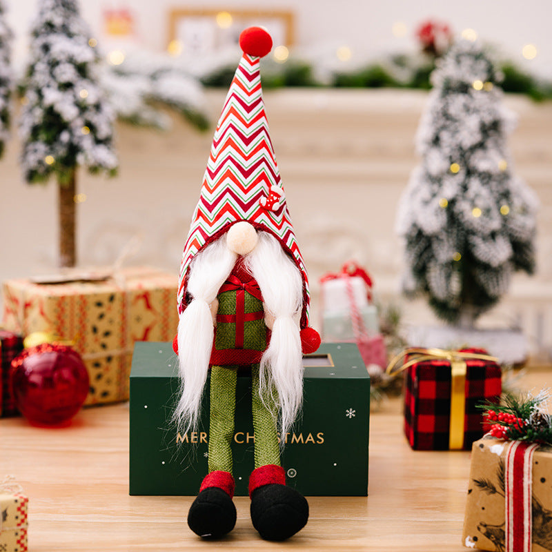 Christmas pointed hat long legg gnomes holding gift box